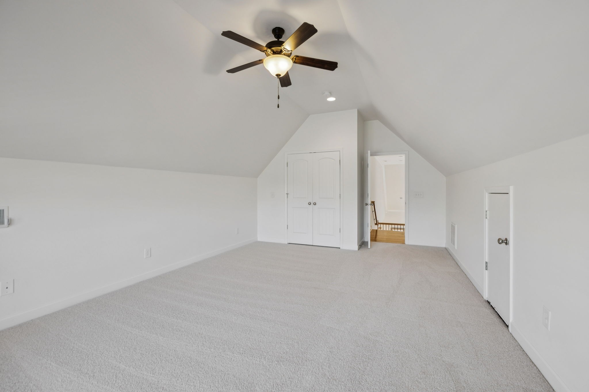 2002 Virgle Circle Spring Hill, TN 37174 - Photo 33 of 44 an empty room with a ceiling fan and wooden floor