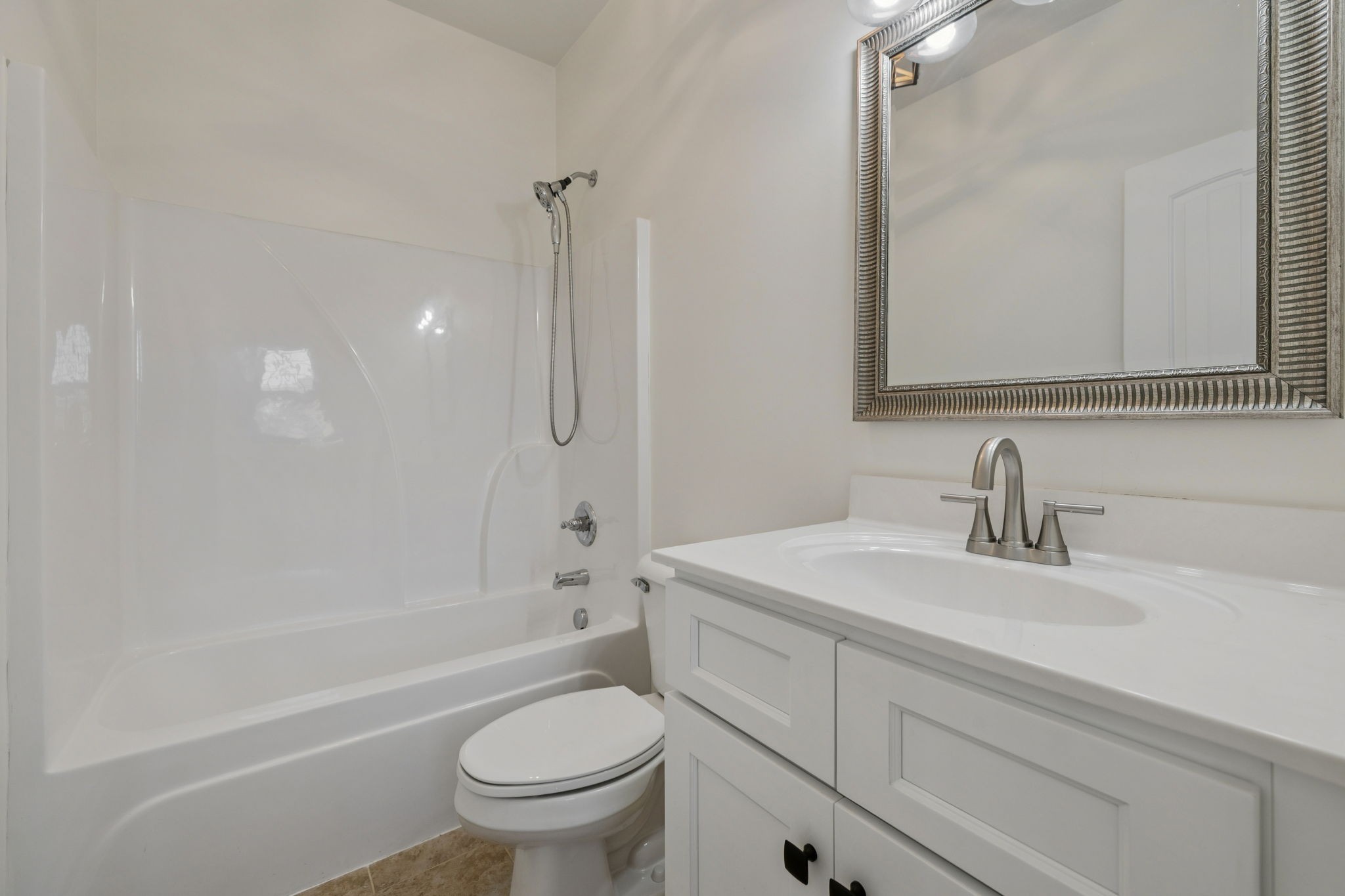 2002 Virgle Circle Spring Hill, TN 37174 - Photo 7 of 44 a bathroom with a sink a toilet and a mirror