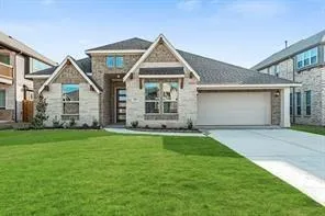 a view of a house with a yard and a garden