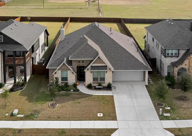 an aerial view of a house with swimming pool
