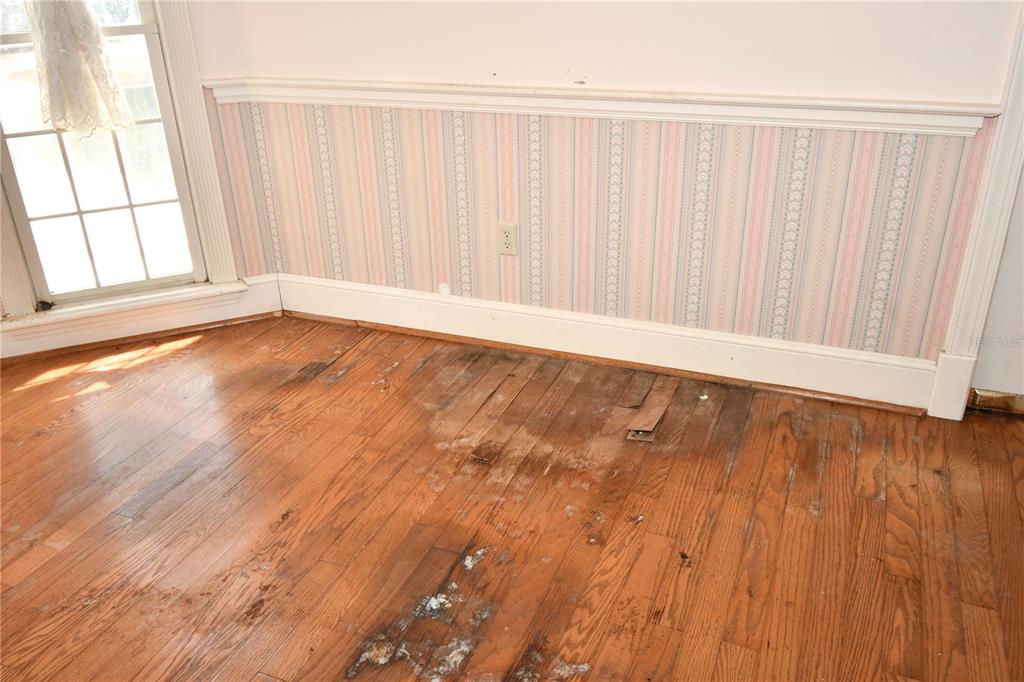 600 Old Eustis Road Mount Dora, FL 32757 - Photo 11 of 29 an empty room with wooden floor and windows with wooden floor