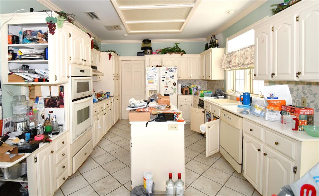 600 Old Eustis Road Mount Dora, FL 32757 - Photo 12 of 29 a kitchen with cabinets and window