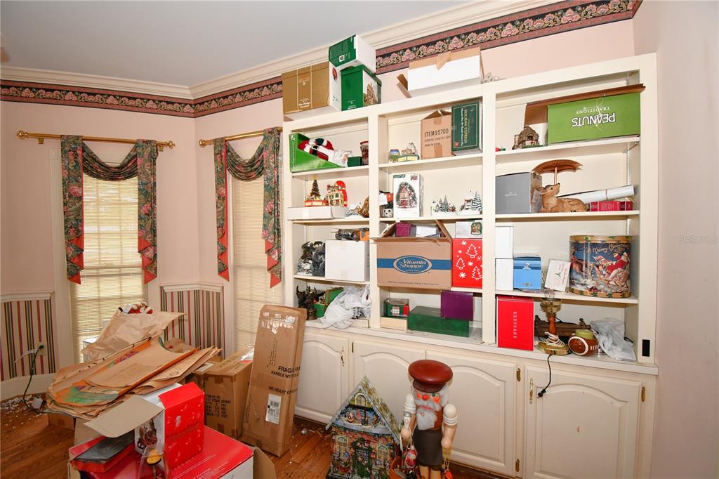 600 Old Eustis Road Mount Dora, FL 32757 - Photo 16 of 29 a room with furniture a rug toys and windows