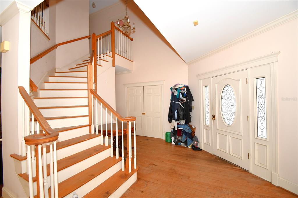 600 Old Eustis Road Mount Dora, FL 32757 - Photo 20 of 29 a view of hallway with stairs and wooden floor