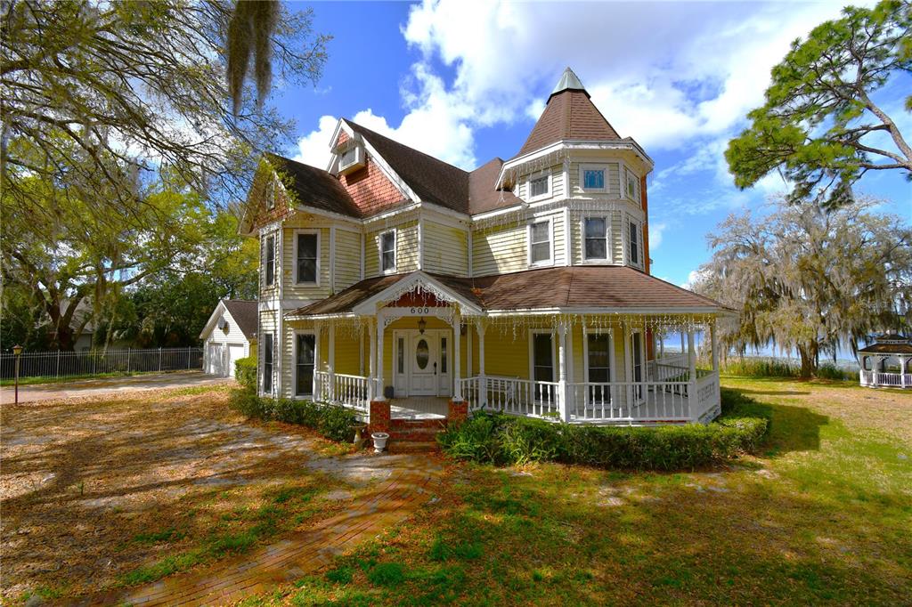 600 Old Eustis Road Mount Dora, FL 32757 - Photo 2 of 29 a front view of a house with a yard