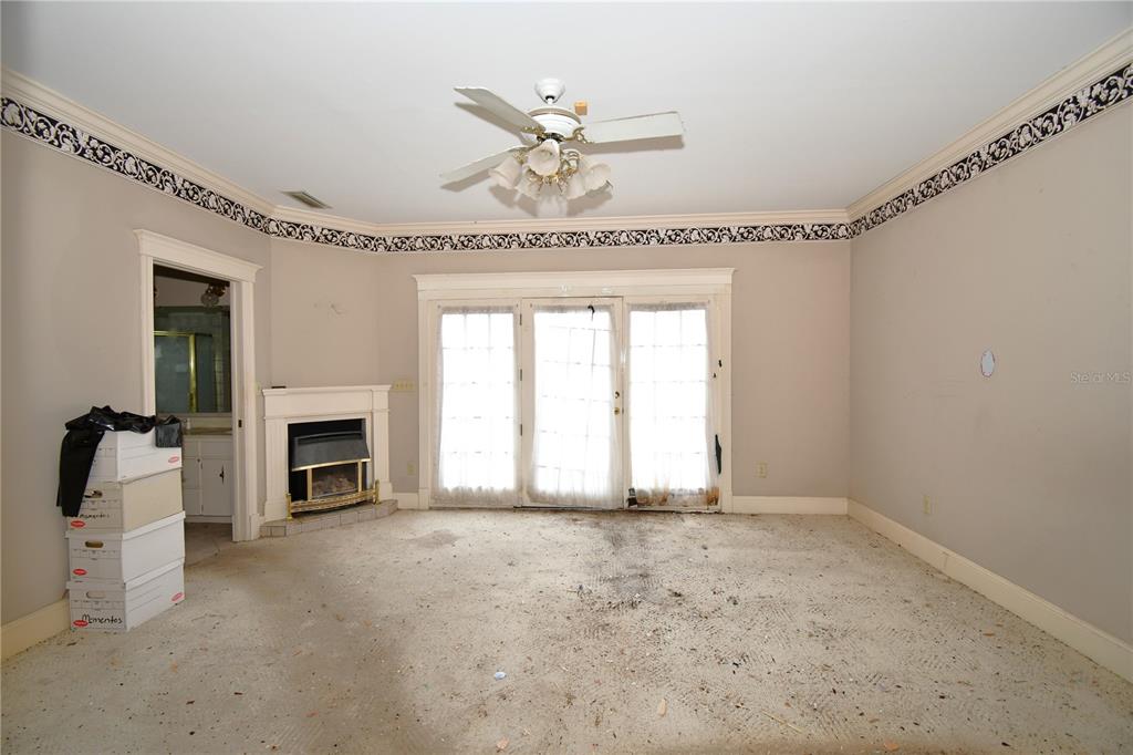 600 Old Eustis Road Mount Dora, FL 32757 - Photo 23 of 29 a view of an empty room with a fireplace