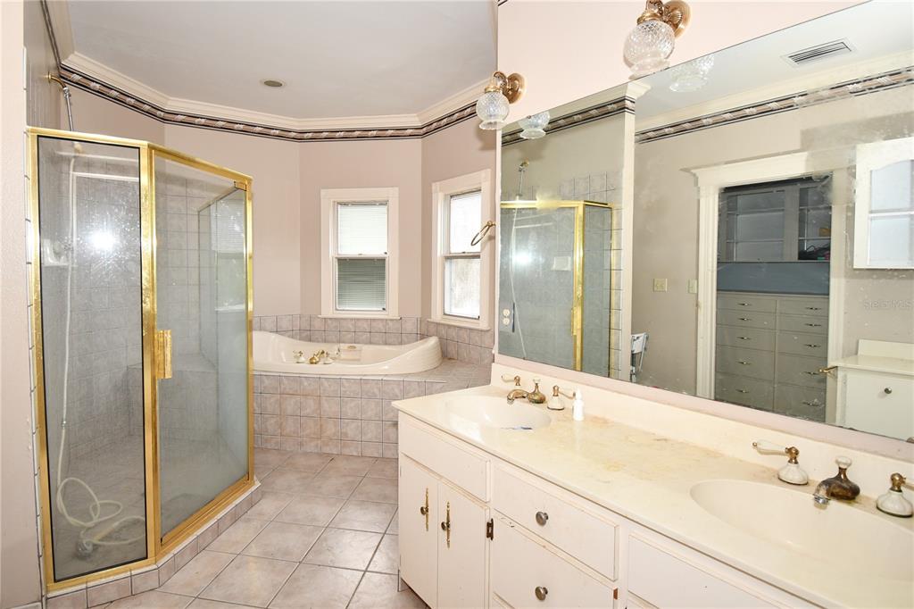 600 Old Eustis Road Mount Dora, FL 32757 - Photo 24 of 29 a bathroom with a double vanity sink mirror and shower