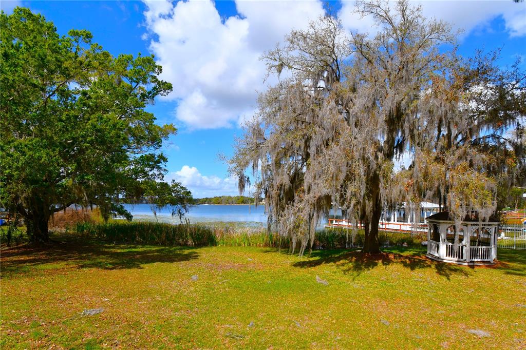 600 Old Eustis Road Mount Dora, FL 32757 - Photo 29 of 29 a view of a swimming pool with an outdoor seating and a yard