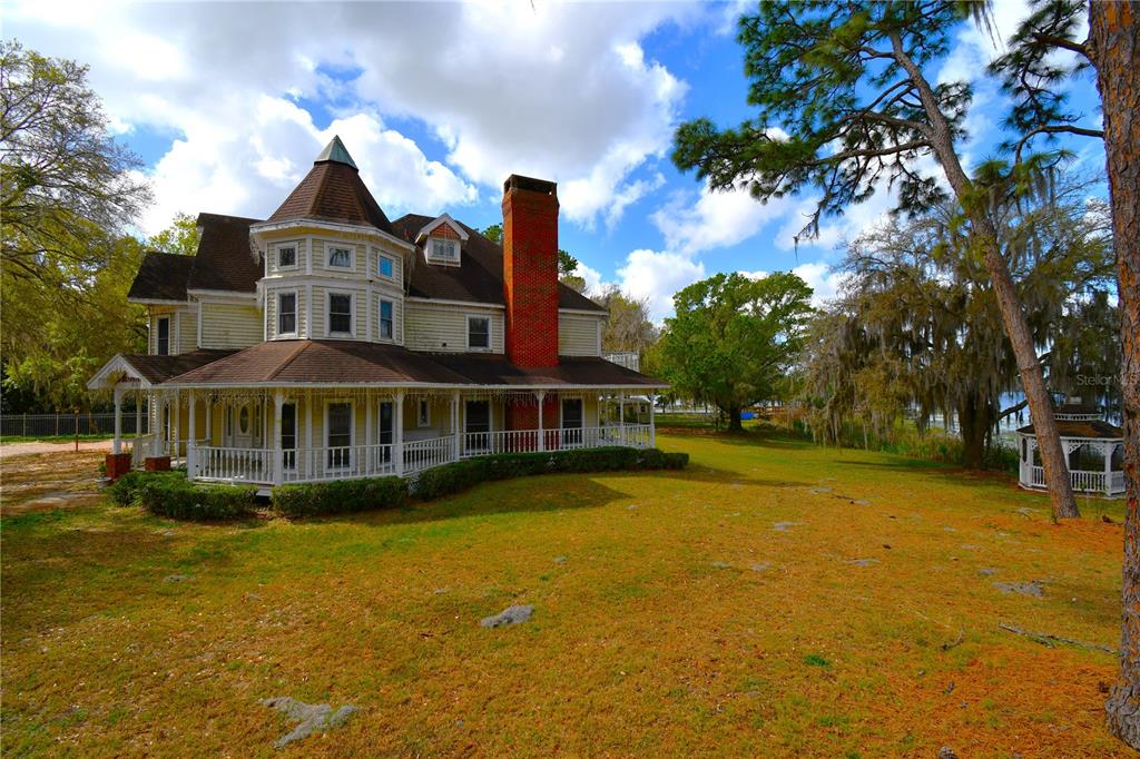 600 Old Eustis Road Mount Dora, FL 32757 - Photo 4 of 29 a front view of a house with swimming pool