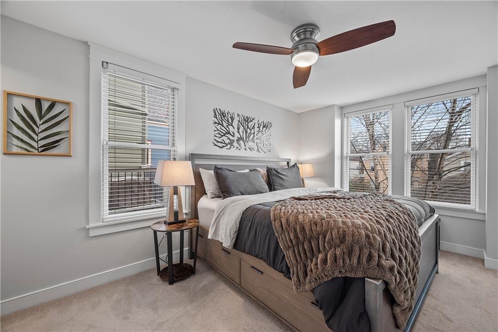 706 Ivy Street, Unit 2 Pittsburgh, PA 15232 - Photo 23 of 35 a bed sitting in a bedroom next to a window
