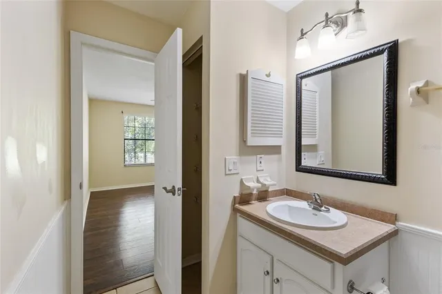 a bathroom with a sink and a mirror