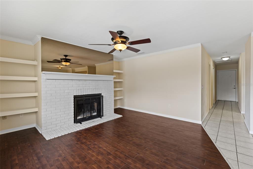6400 Northwest 106th Place, Unit 20 Alachua, FL 32615 - Photo 6 of 40 a living room with furniture and a fireplace