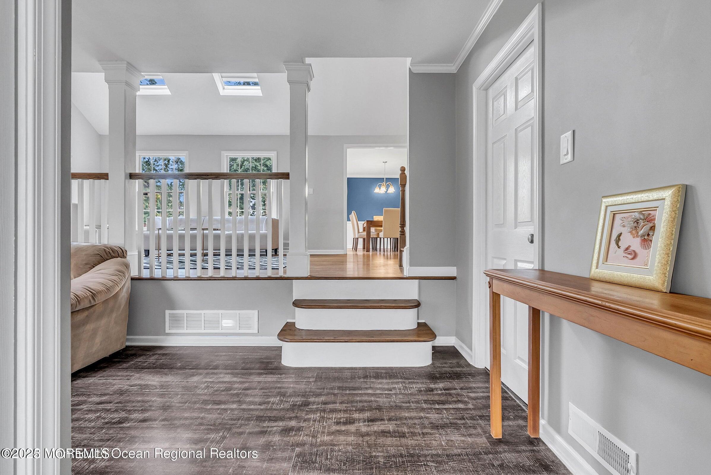 1 Barbara Lane Oakhurst, NJ 07755 - Photo 2 of 8 a view of entryway and hall with wooden floor