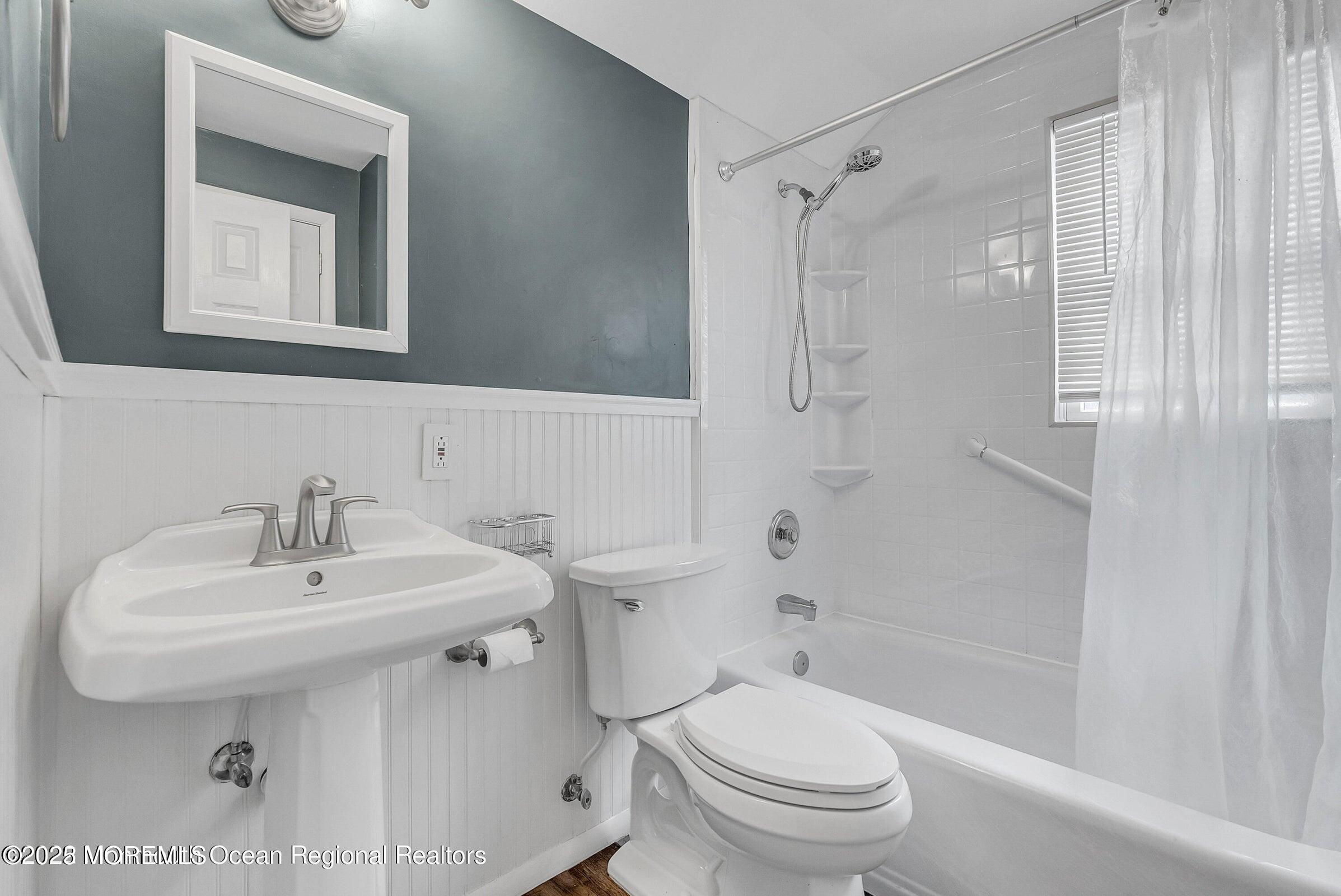 1 Barbara Lane Oakhurst, NJ 07755 - Photo 8 of 8 a bathroom with a sink toilet and shower