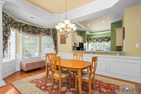 a large kitchen with stainless steel appliances granite countertop a stove and a sink