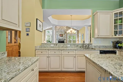a kitchen with stainless steel appliances a refrigerator sink and microwave