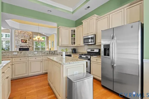 a view of a dining room with furniture and a window