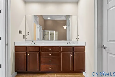 a white bath tub sitting next to a shower