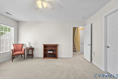 a view of an empty room with a closet