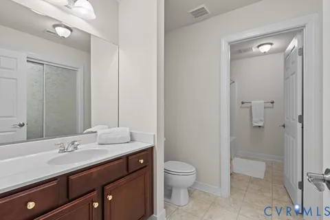 a bedroom with a workspace