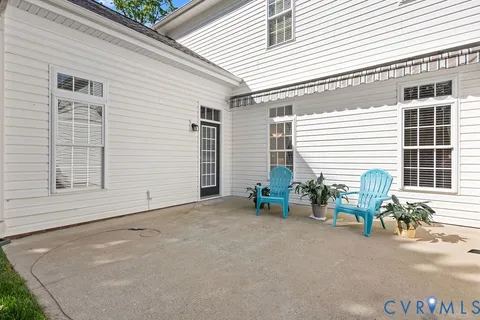 a view of a backyard with large trees