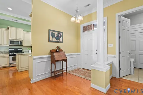 a living room with furniture fireplace and a large window