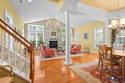 a living room with furniture tv and a large window