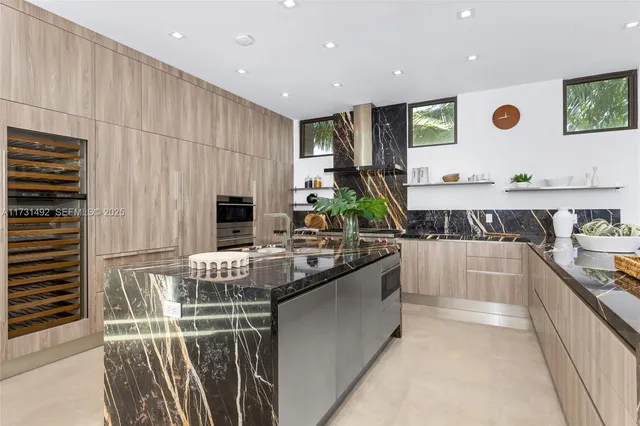 a kitchen with stainless steel appliances a stove and a refrigerator