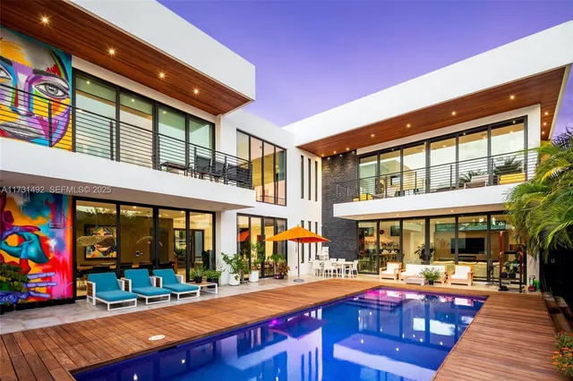 a view of an chairs and table in the patio