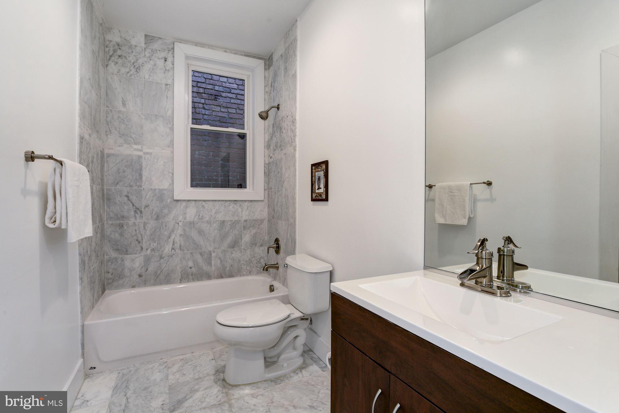 3605 13th Street Northwest Washington, DC 20010 - Photo 16 of 28 Hall bath with dual entry to the back bedroom