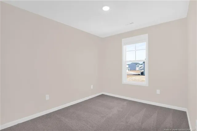 an aerial view of a house with a ocean view