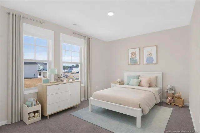 a bedroom with a bed and a table in it