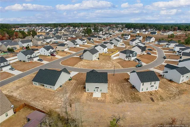 an aerial view of a house with a ocean view