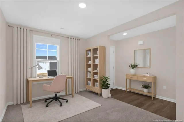 a workspace with furniture and window