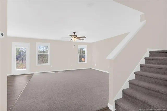 a kitchen with granite countertop a sink and a stove top oven