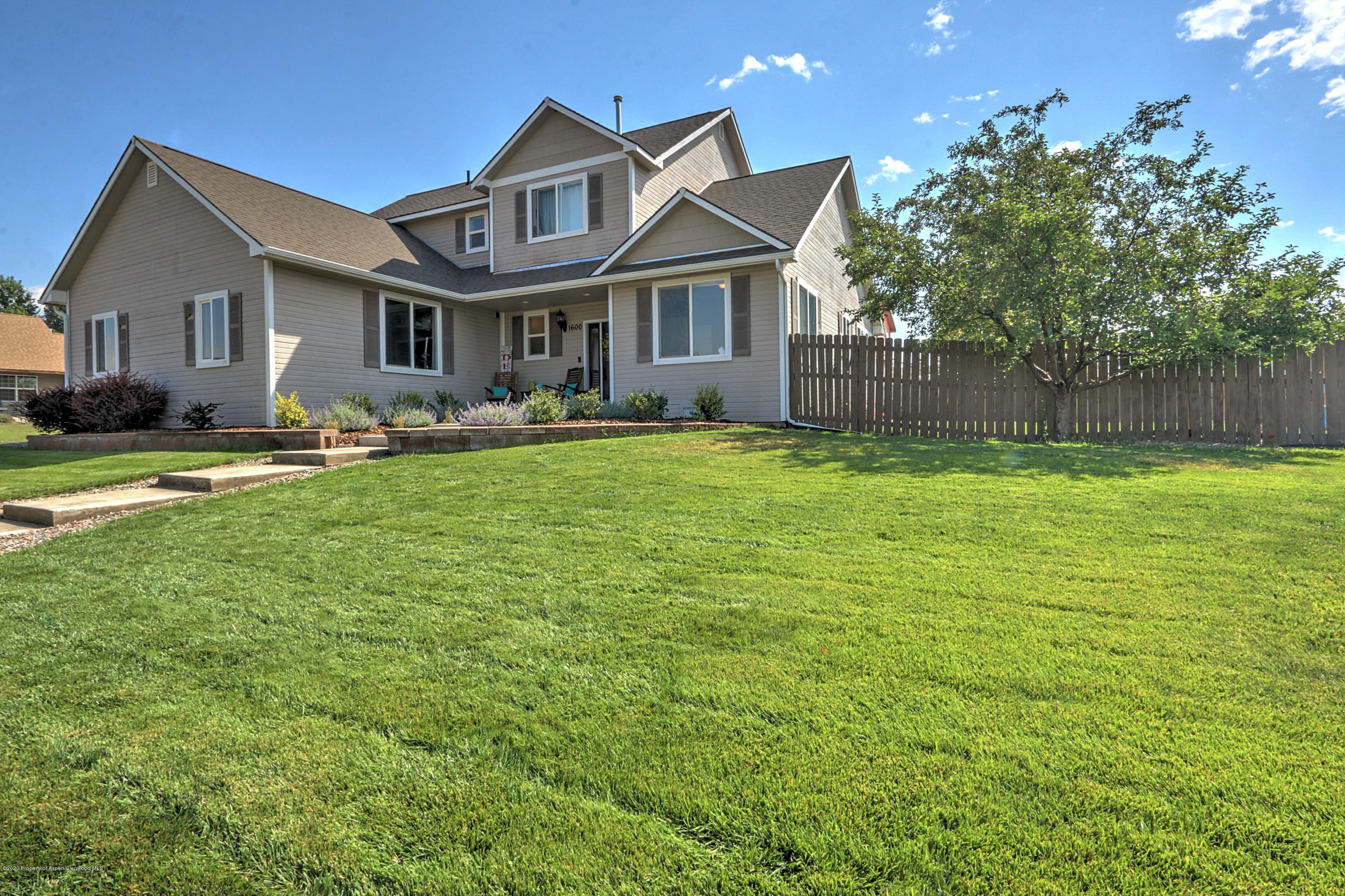 1600 Anvil View Avenue Rifle, CO 81650 - Photo 1 of 22 a front view of a house with a garden and porch