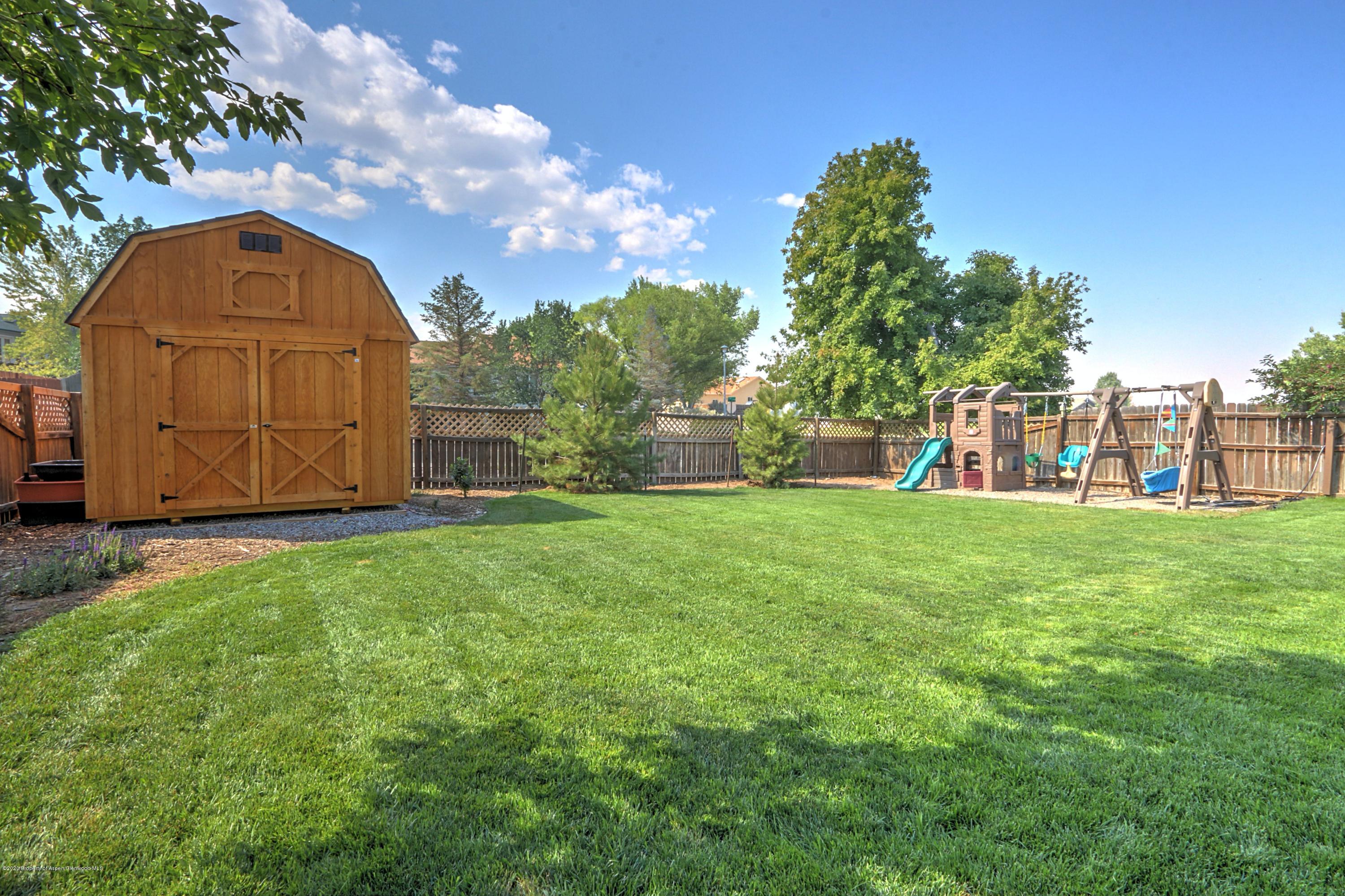 1600 Anvil View Avenue Rifle, CO 81650 - Photo 19 of 22 a view of swimming pool with garden and trees