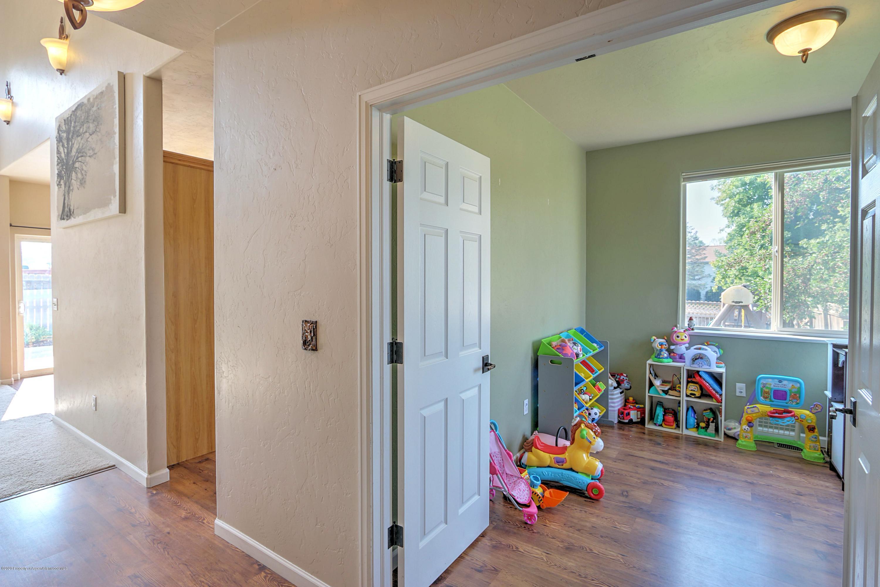 1600 Anvil View Avenue Rifle, CO 81650 - Photo 3 of 22 a children room with toys a fireplace and toys