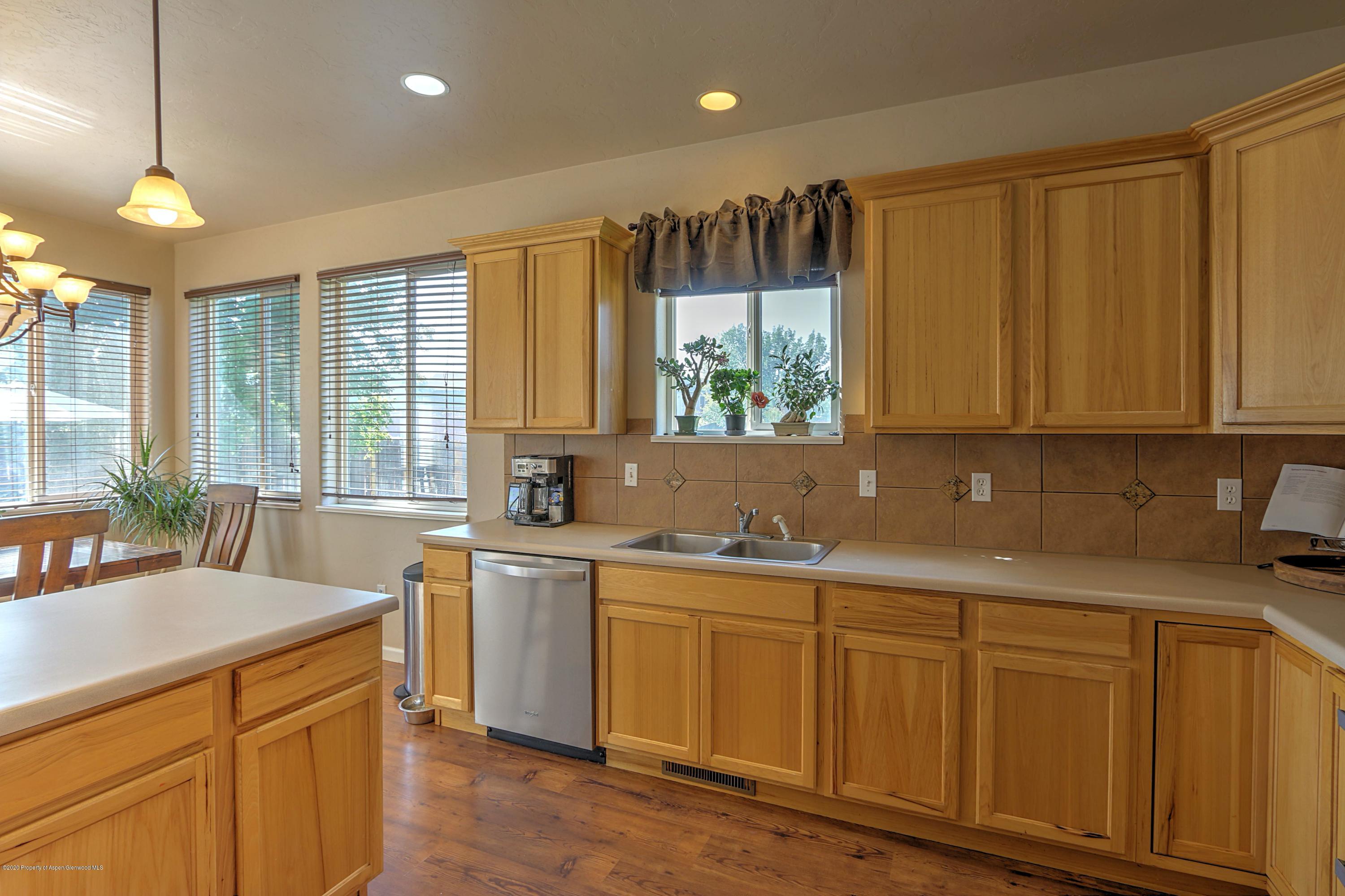 1600 Anvil View Avenue Rifle, CO 81650 - Photo 6 of 22 a kitchen with a sink window and cabinets