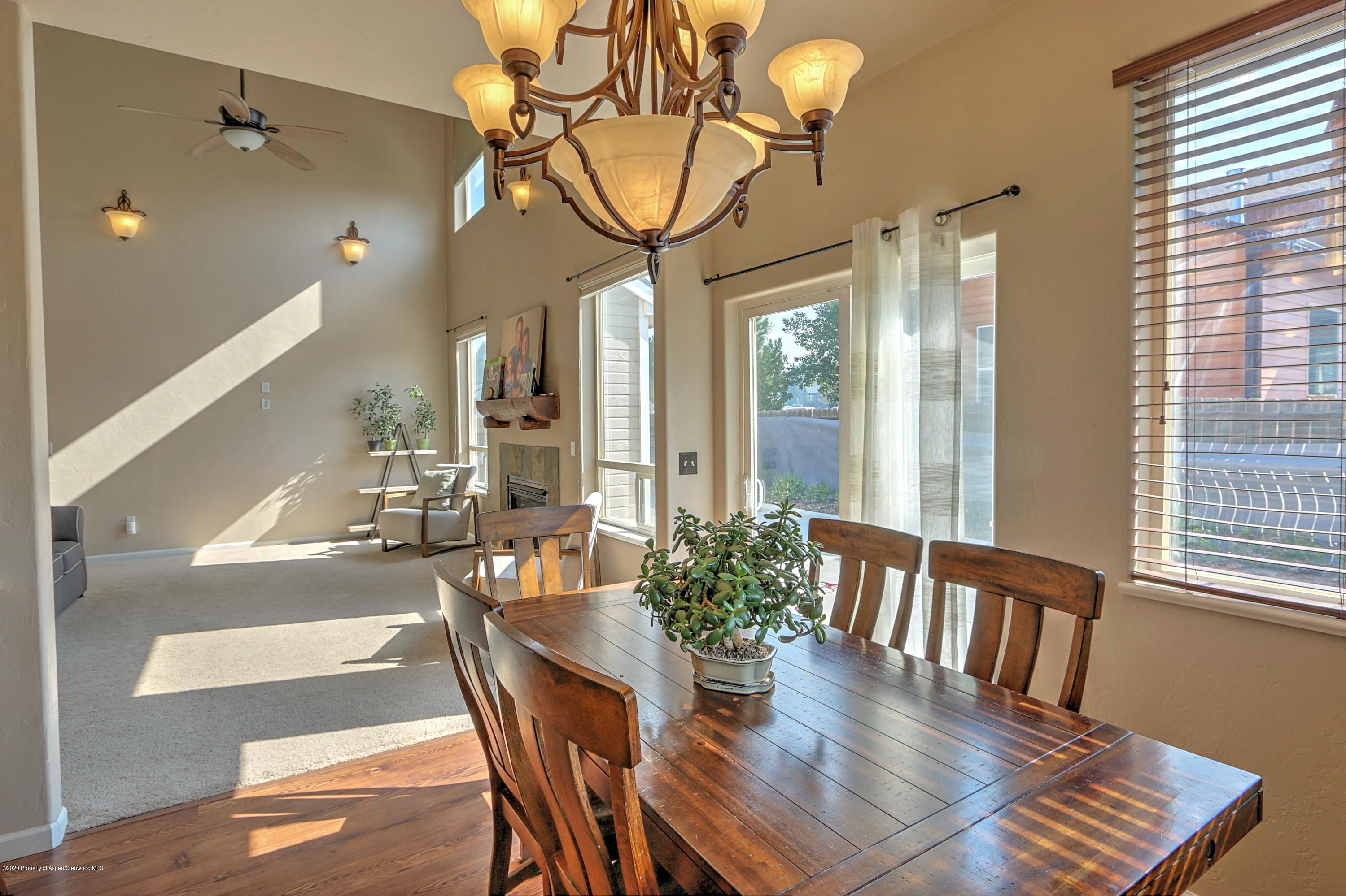 1600 Anvil View Avenue Rifle, CO 81650 - Photo 7 of 22 a view of a dining room with furniture and a chandelier