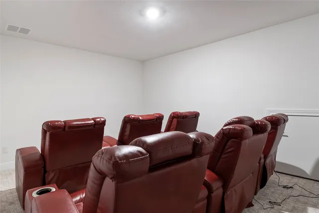 a couch sitting in a room next to a lamp