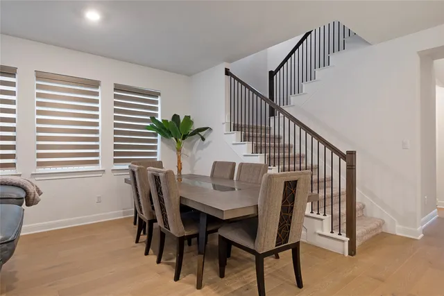 a view of a dining room with furniture and window
