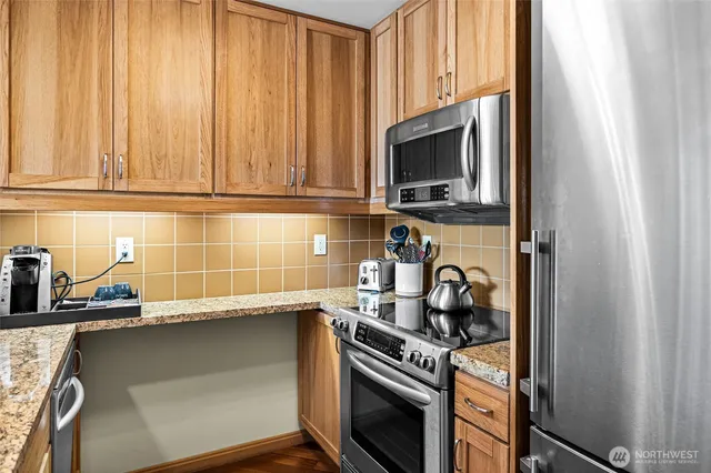 a kitchen with a stove and a microwave