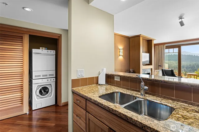 a kitchen with a sink and a refrigerator