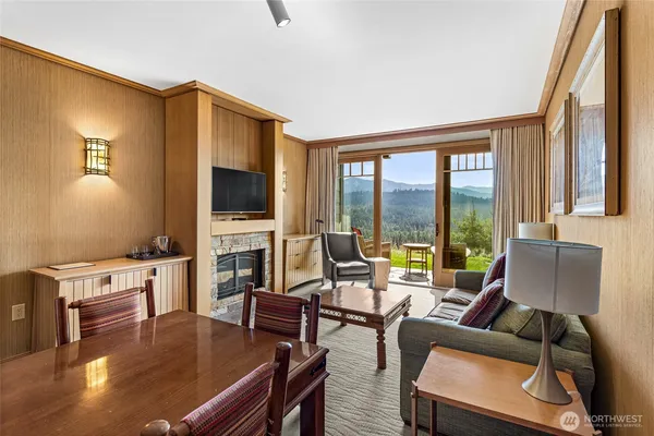 a living room with fireplace furniture and a flat screen tv