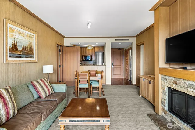 a living room with furniture fireplace and flat screen tv