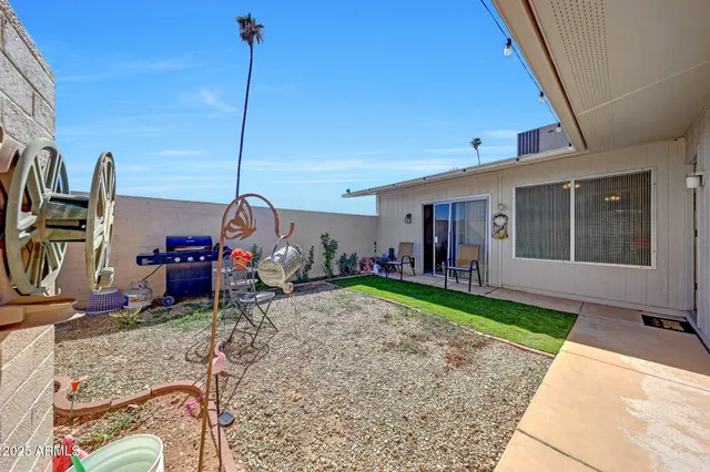 a view of a house with backyard and porch