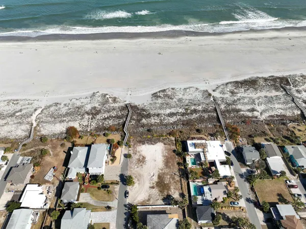 an aerial view of a house with a ocean view