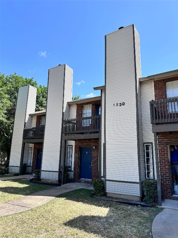 a front view of a house with barbeque