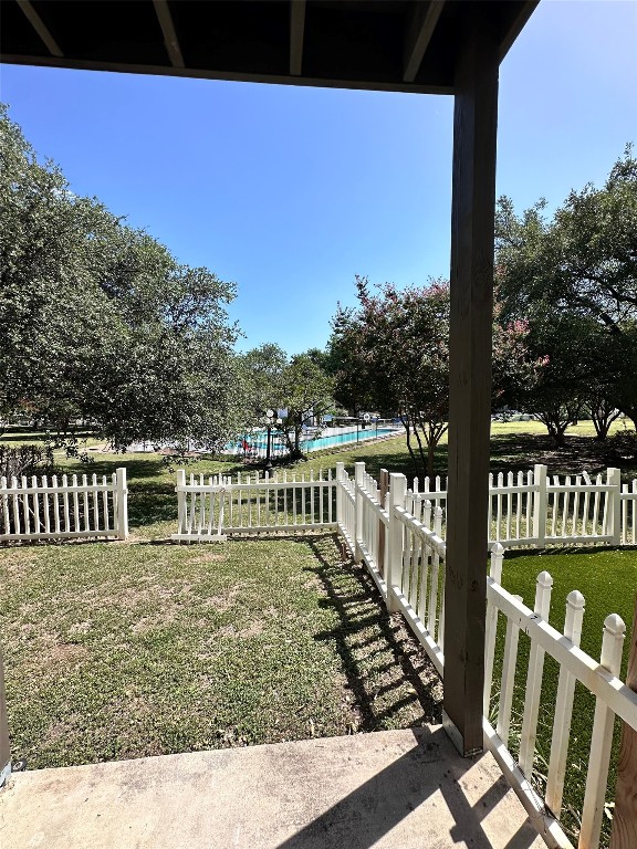 1830 River Crossing Circle, Unit C Austin, TX 78741 - Photo 7 of 16 a balcony with wooden floor and yard